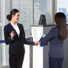 Airport terminal officer assists customer